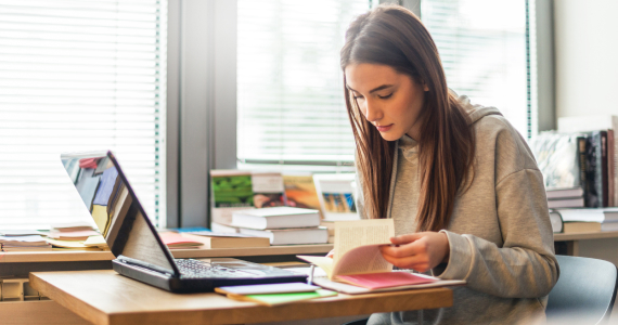 Girl studying with her laptop